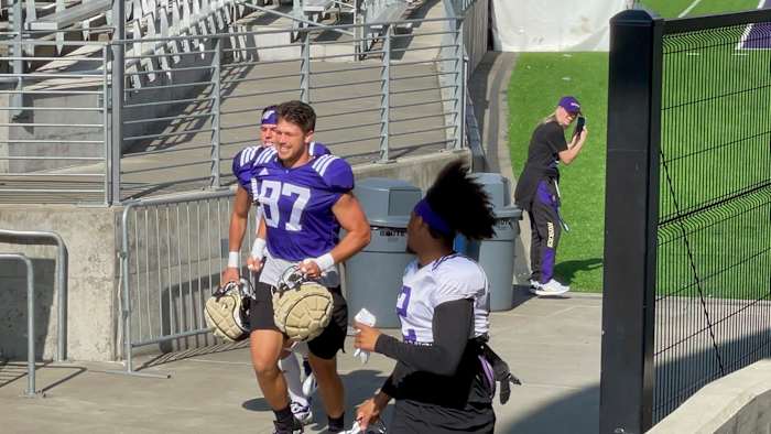 Cade Otton arrives at practice.
